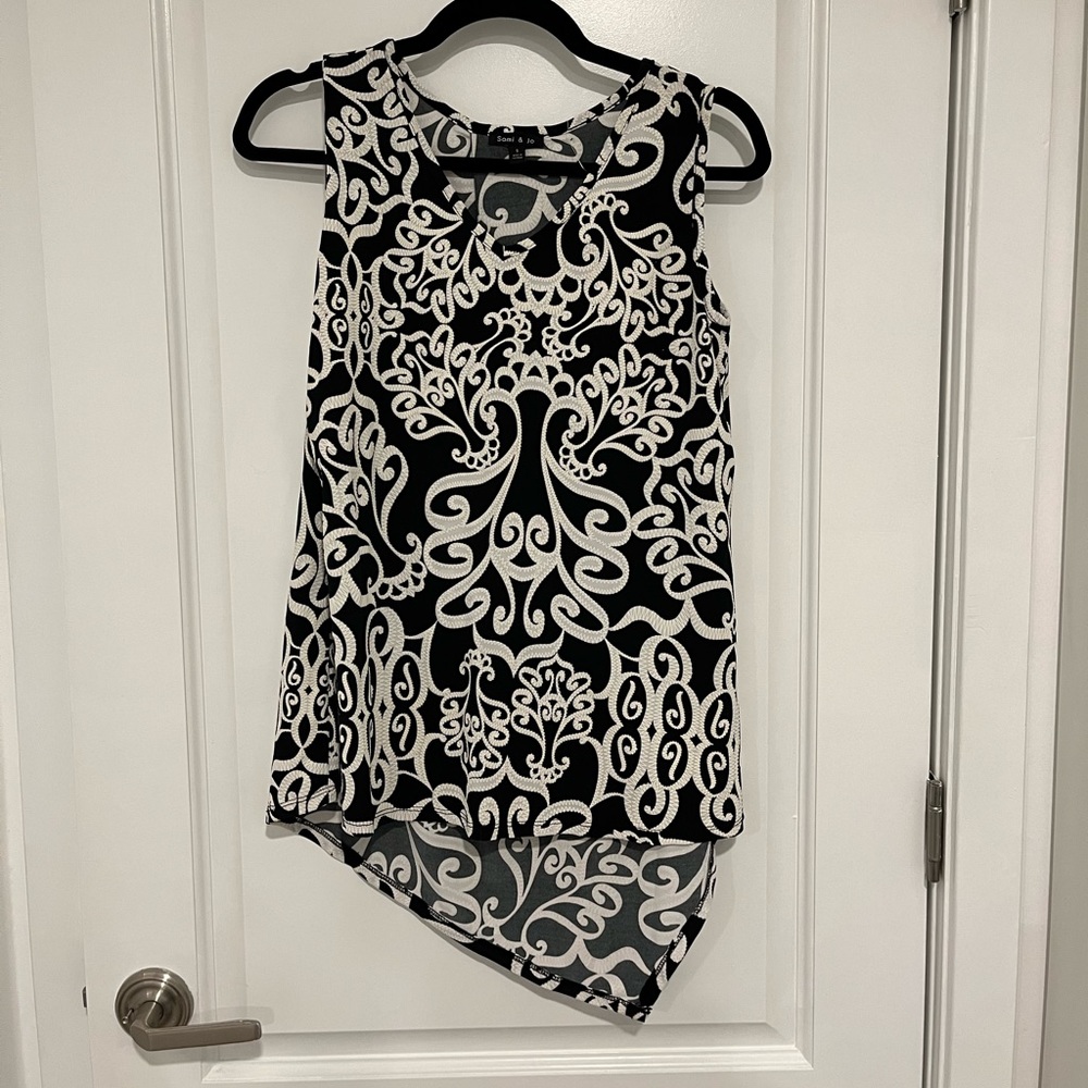 Black and white floral design blouse. Sleeveless.